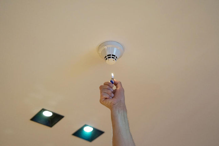 Standalone smoke detector mounted on a ceiling