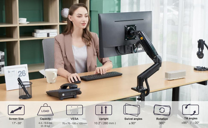 Monitor arm on an office desk